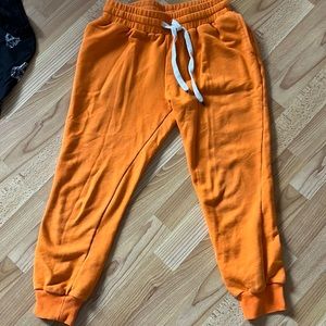Dance & Marvel orange cropped sweatpants